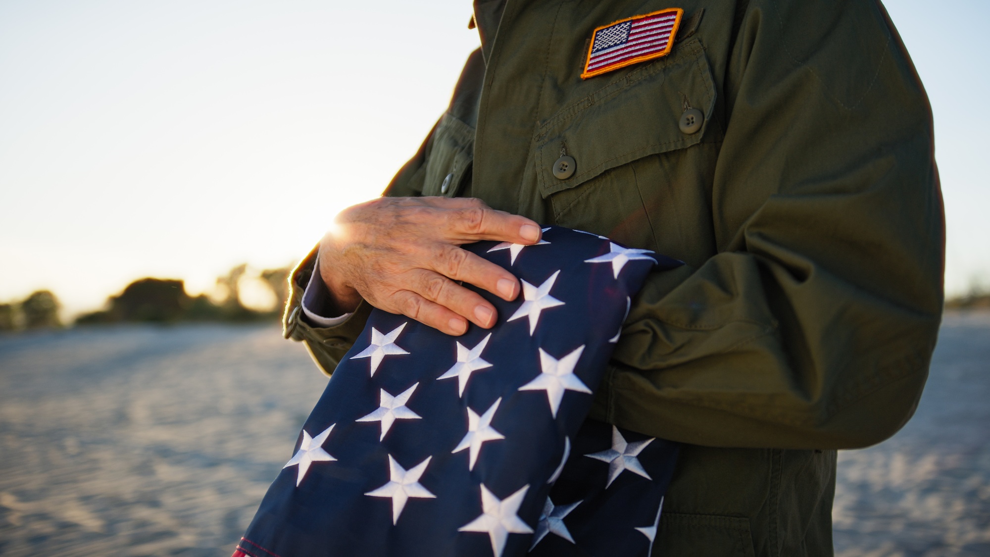 Veteran holding American flag
